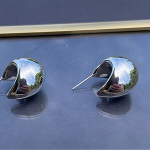 Silver moon shaped half hoop earrings